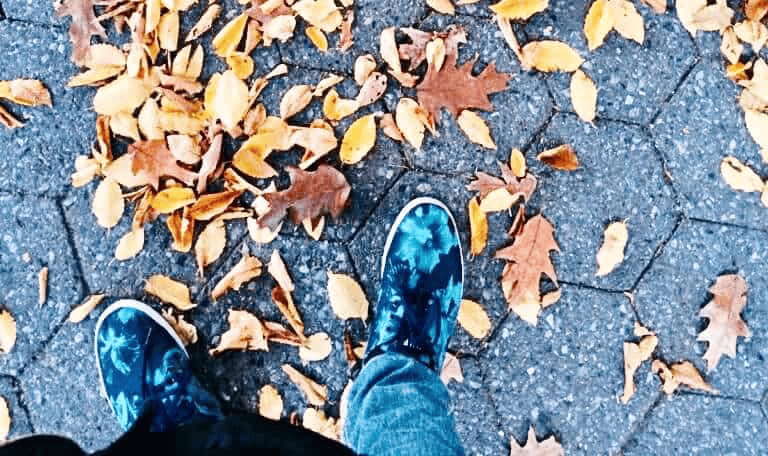 “Walking in nature during fall surrounded by colorful autumn leaves”
